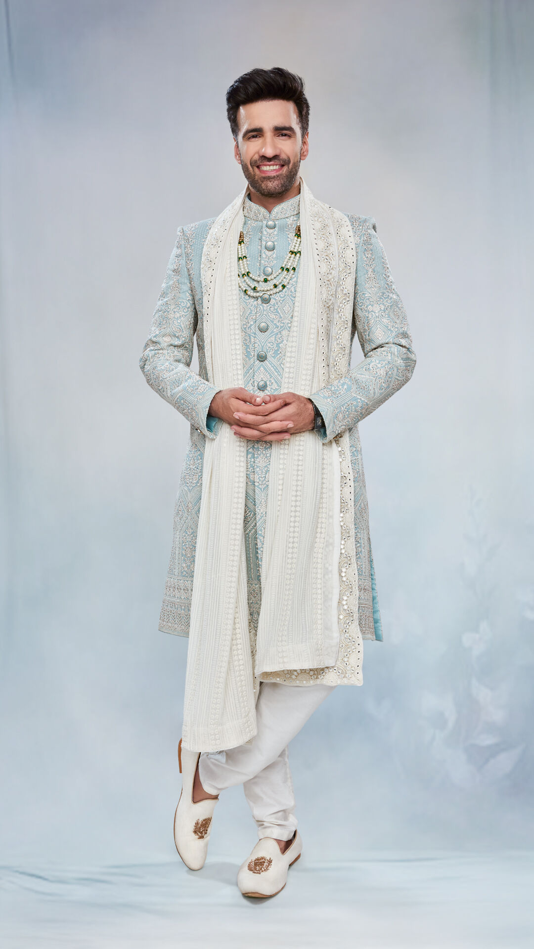 A groom in blue pastel sherwani for wedding